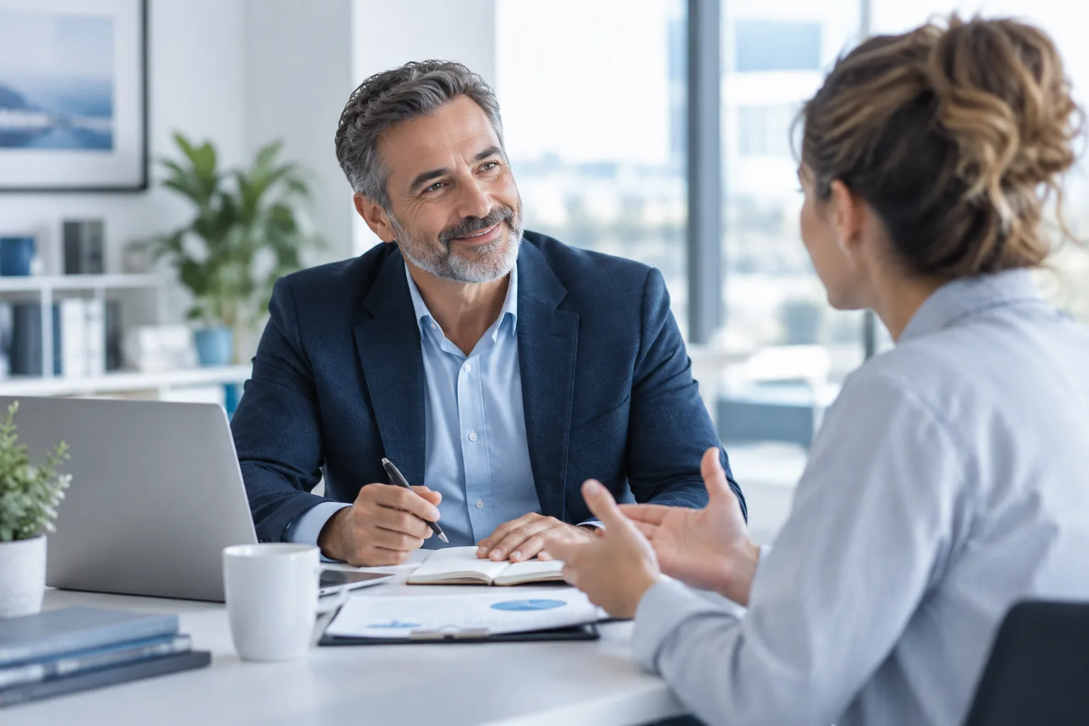 Insurance advisor listening to a business owner during a consultation
